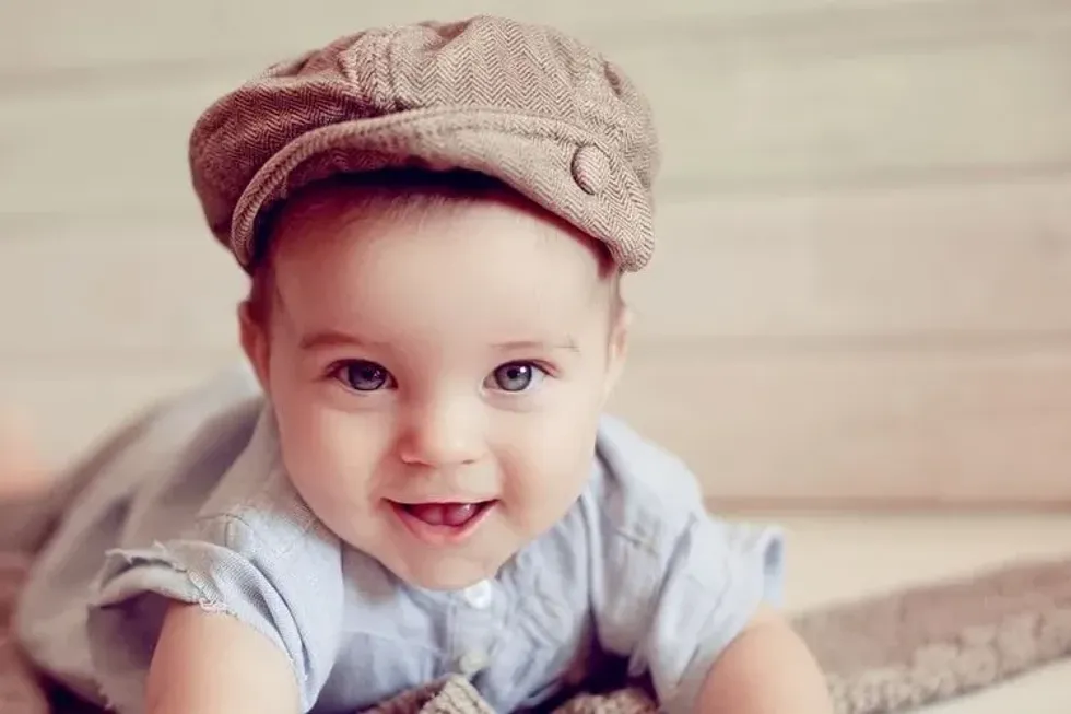 A cute newborn baby wearing a hat