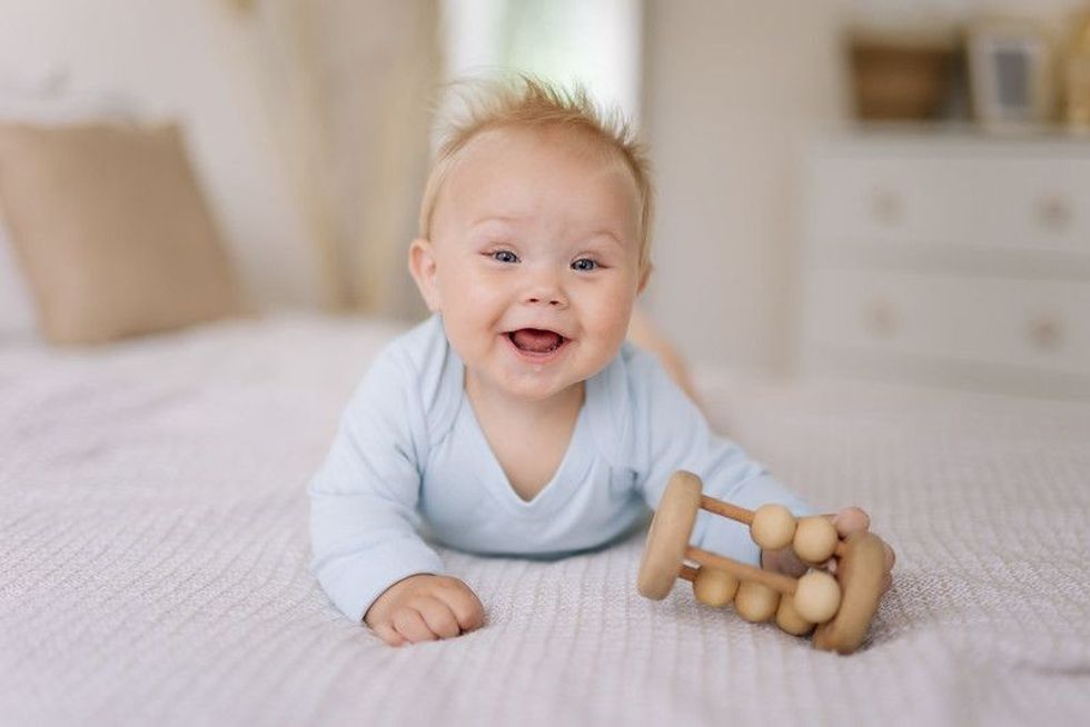 A happy smiling 9 months old baby boy