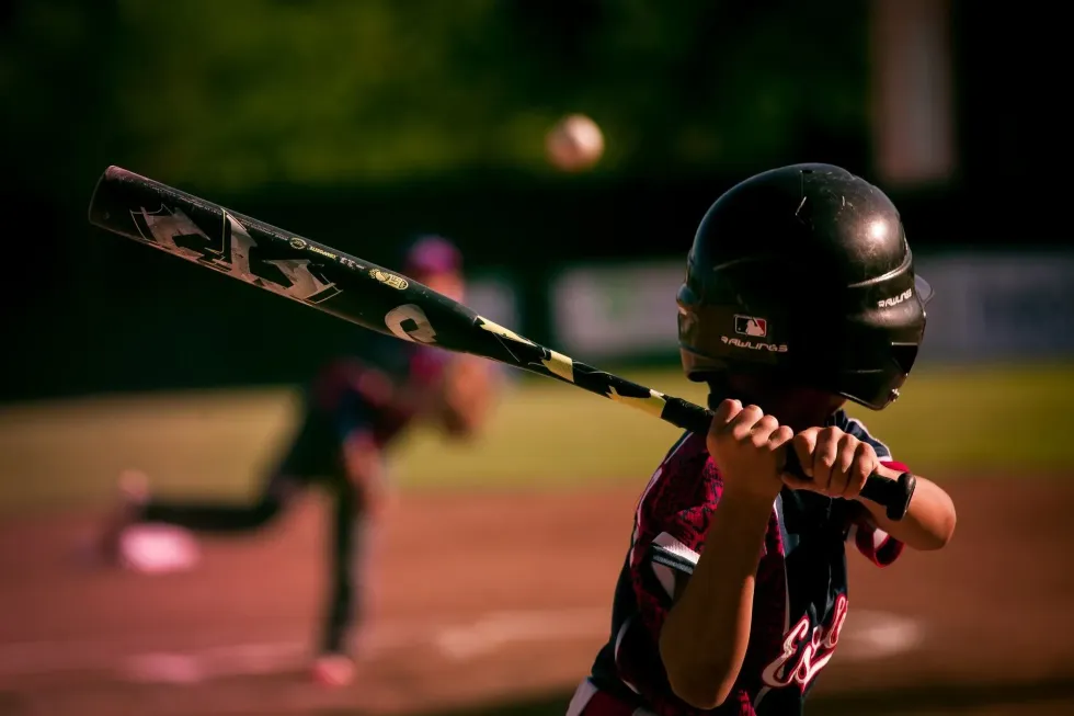 A little kid ready to swing the baseball bat