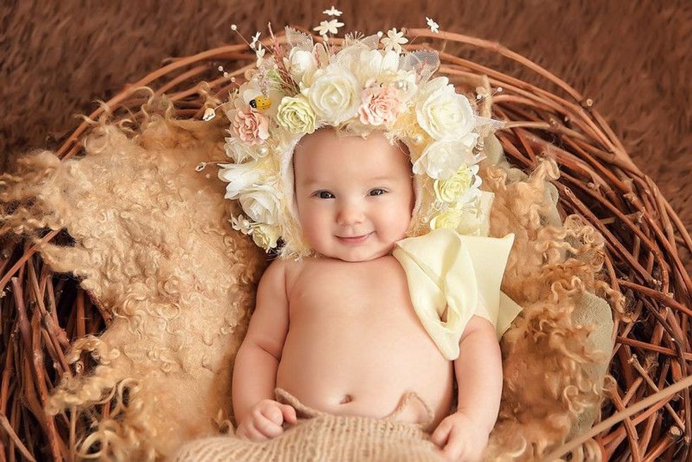 Adorable beautiful newborn baby girl Maternity and newborn concept.