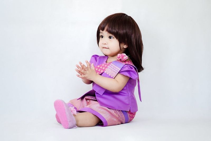 An adorable baby girl in Thai traditional costume