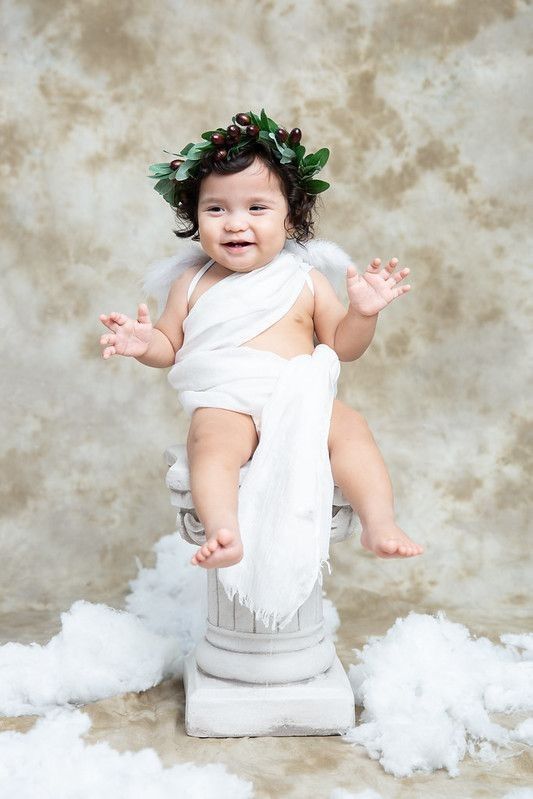 Baby girl dressed as a Greek Goddess.