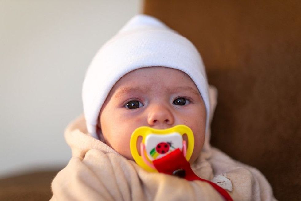 Baby with baby pacifier