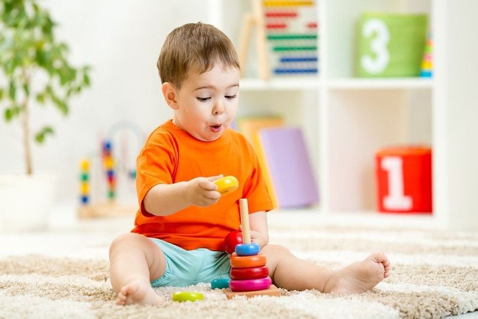 Boy playing with toys at home