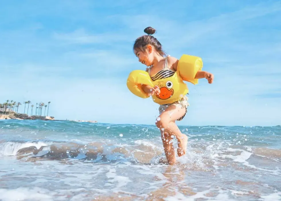 Girl playing on the beach