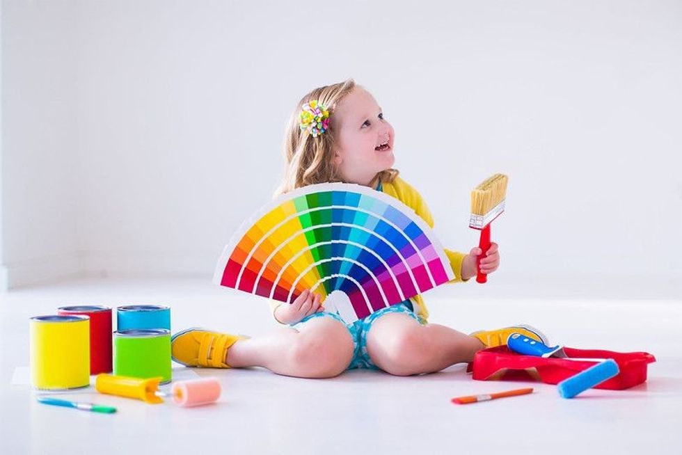 Girl with painting brush in hand