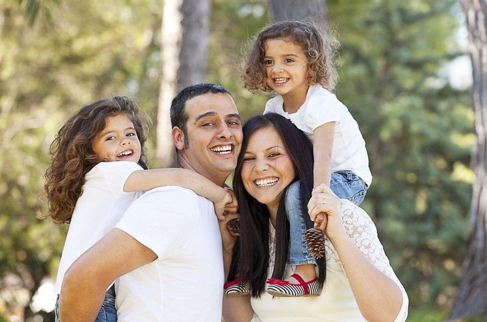 Happy family having fun in outdoor.