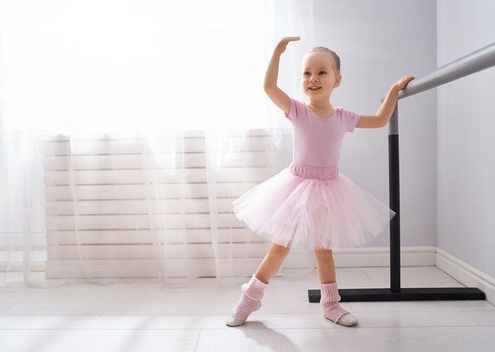 Little girl posing in a dance move