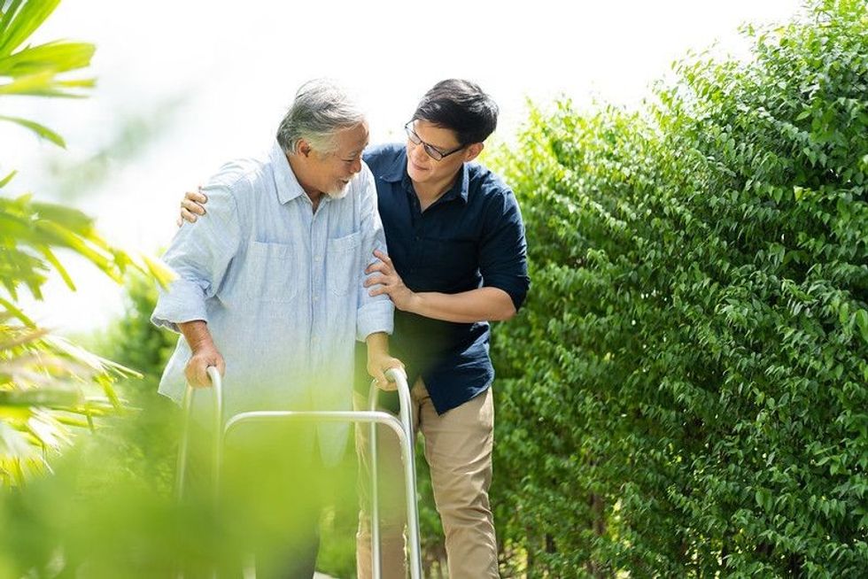 Man healping a elder person