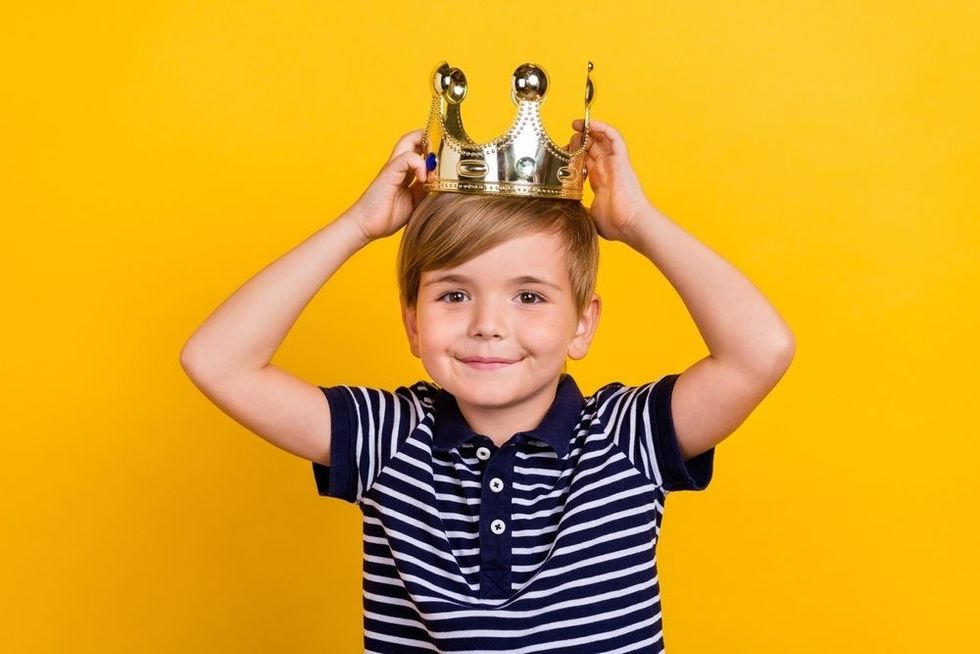 Photo portrait little prince wearing golden crown smiling overjoyed isolated vibrant yellow color background.