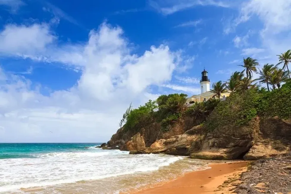 Puerto Rico coastline beach at Punta Tuna lighthouse in summer with a blue sky and clouds