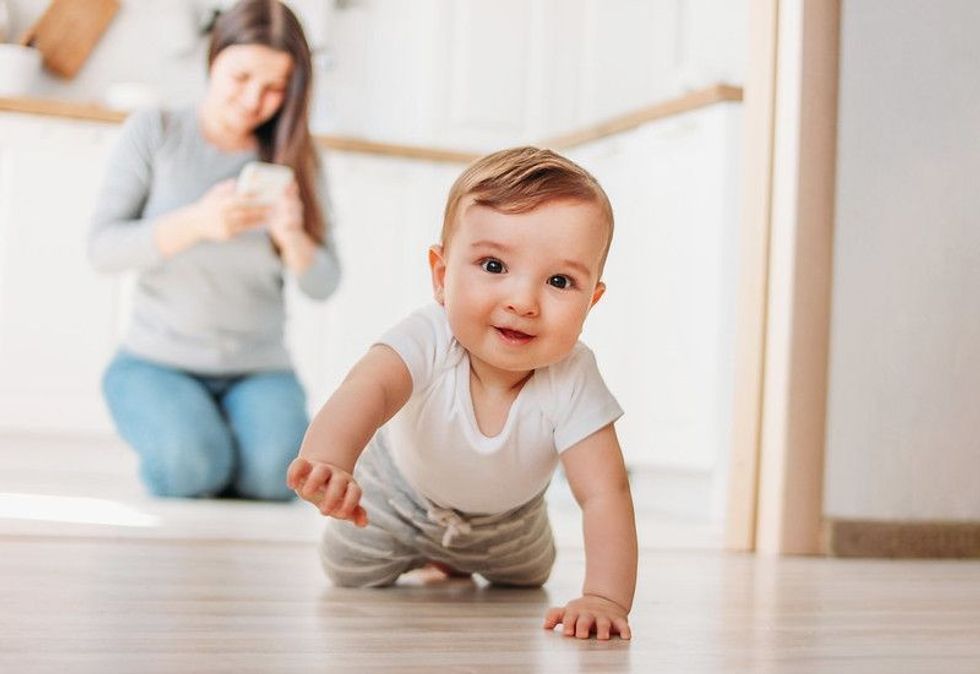 The cute baby boy is exploring the world