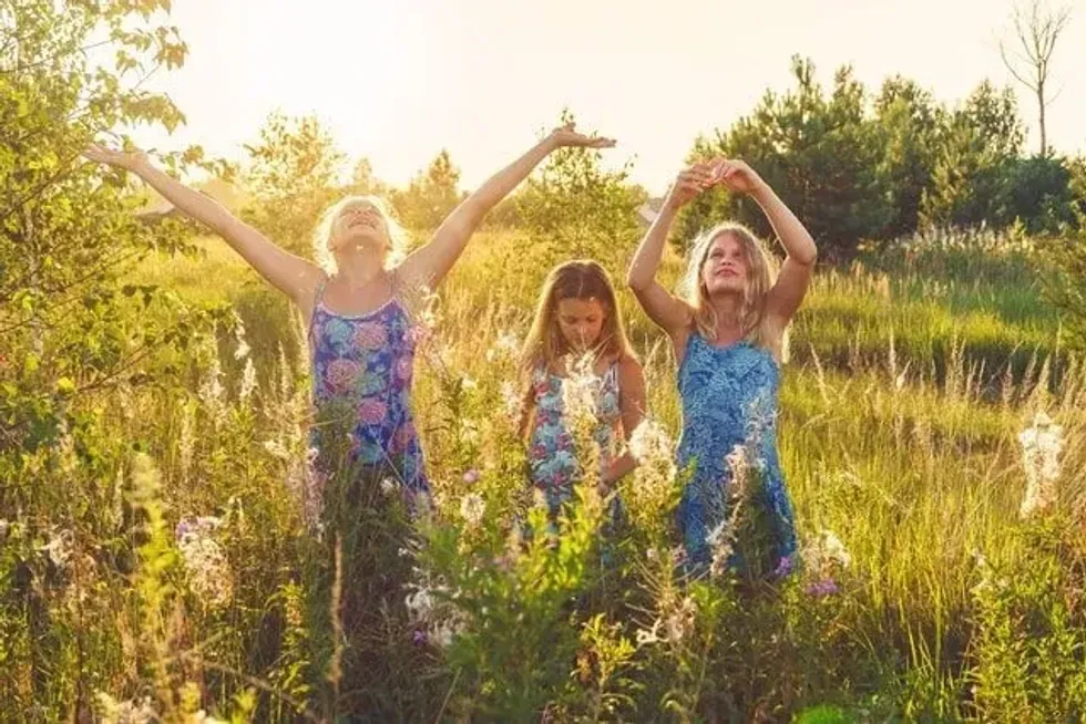 Three girls enjoying in the field