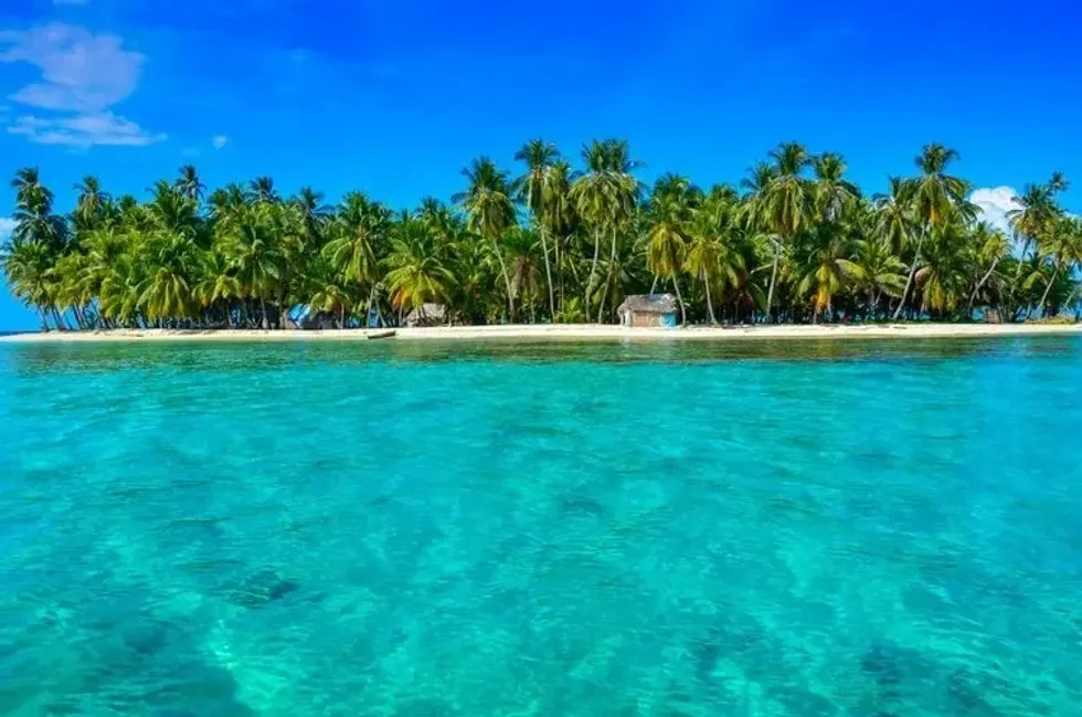 Turquoise blue water and an island